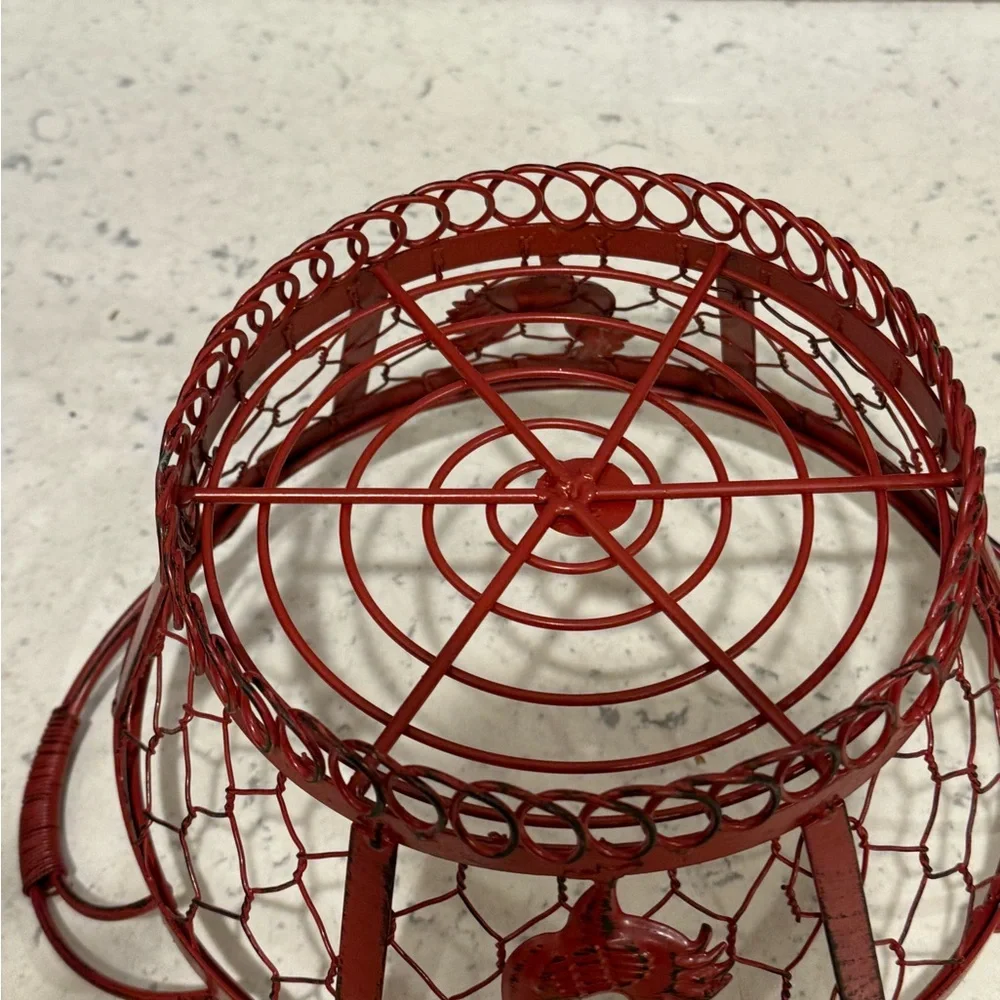 Red Rooster red wired metal basket approximately 7” diameter
